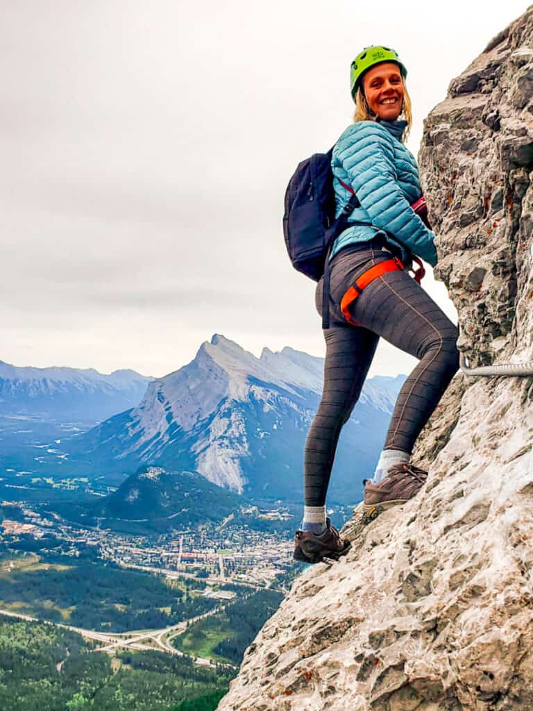 caz hanging off side of mountain on via feratta banff