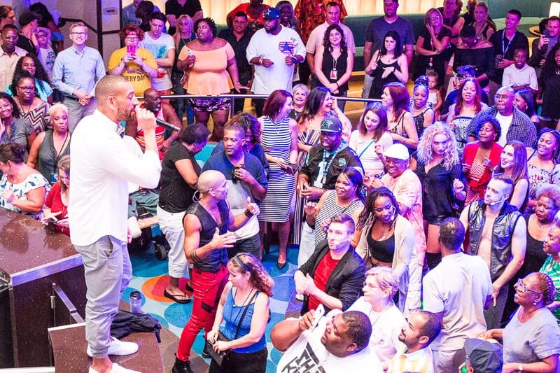 man speaking to crowds at party