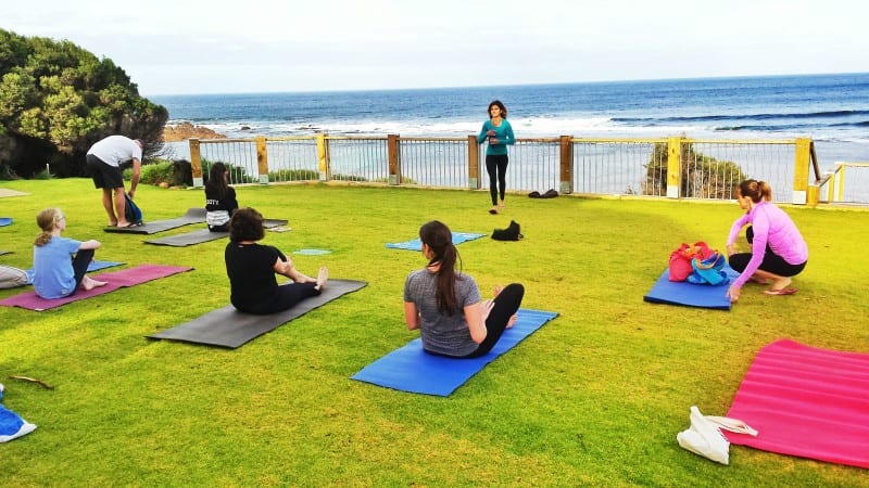 people doing yoga outside