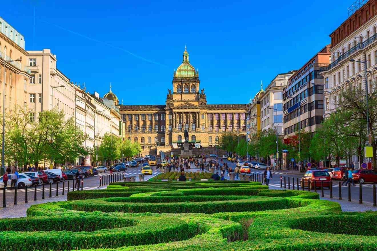 A city with a large building and a hedge maze.