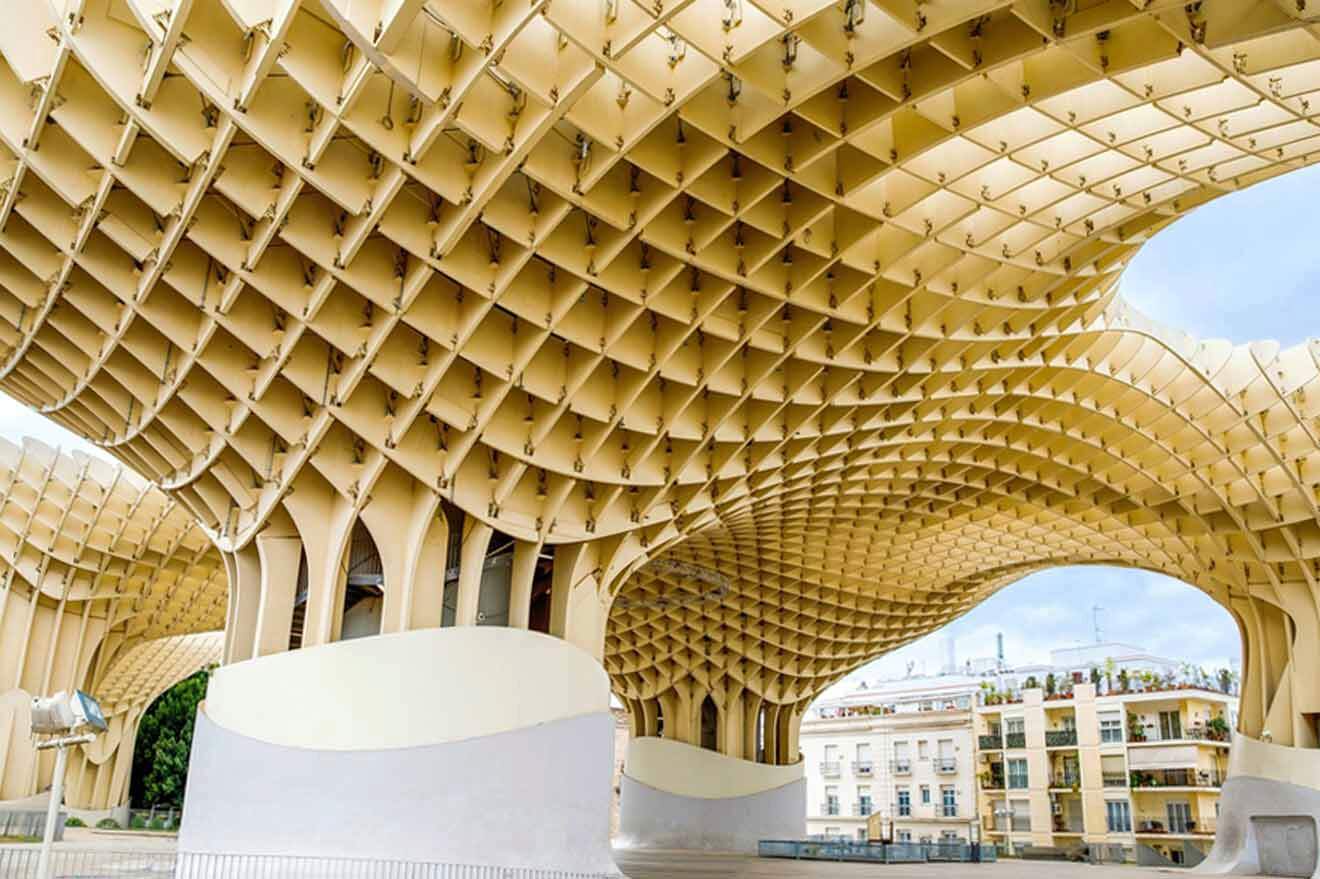 A building with a wooden structure in the middle of a city.