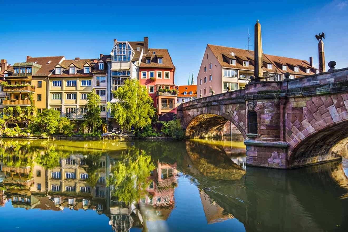 A bridge over a river in a city.