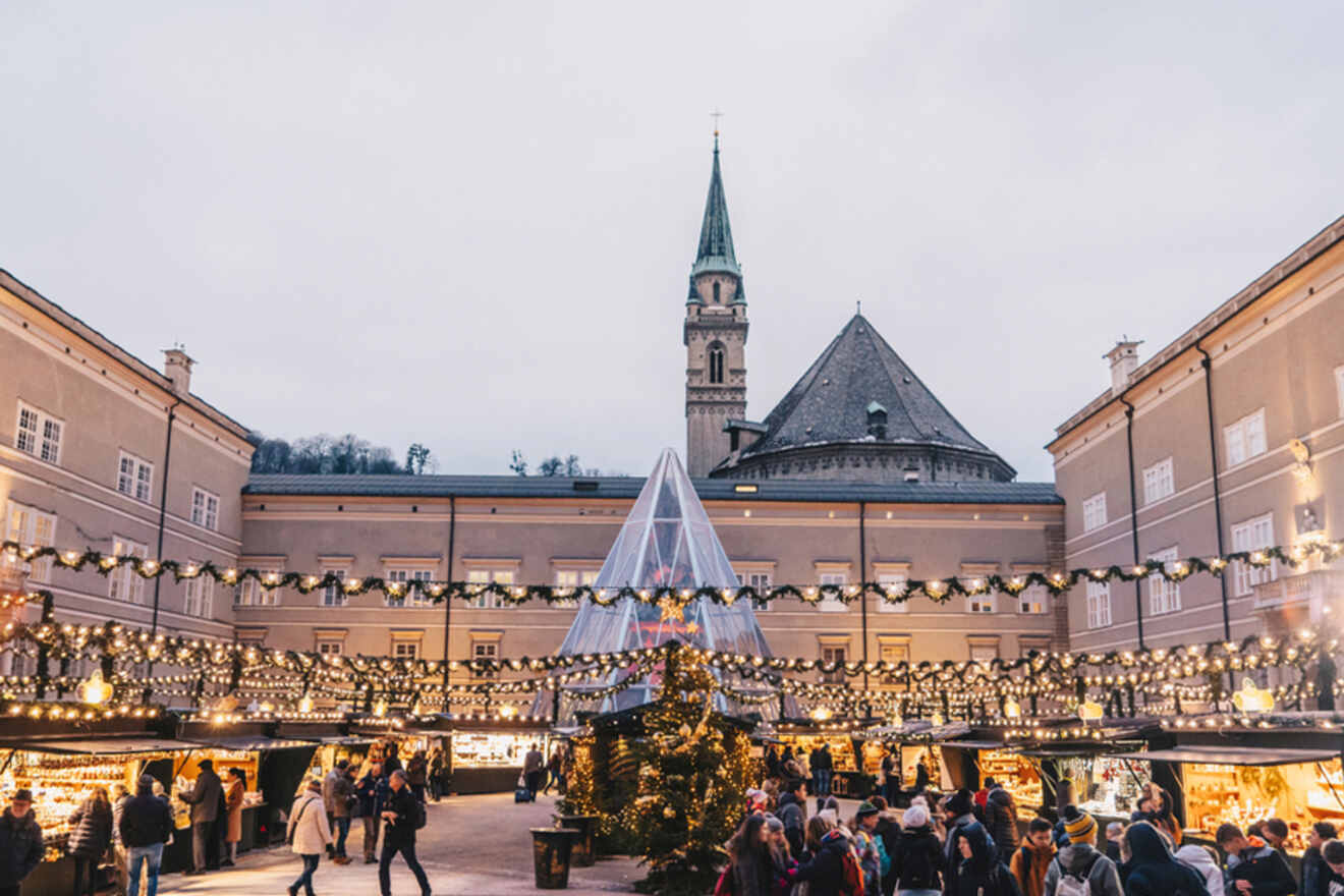 people working around a Christmas market during the day