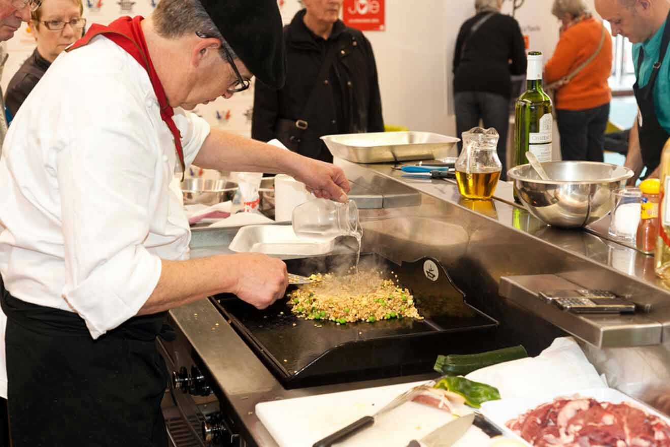 A group of people preparing food in a kitchen.