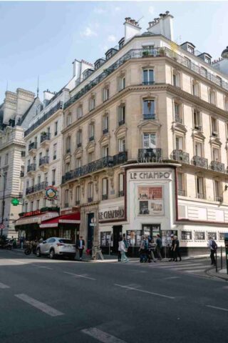 A building on the corner of a street in paris.