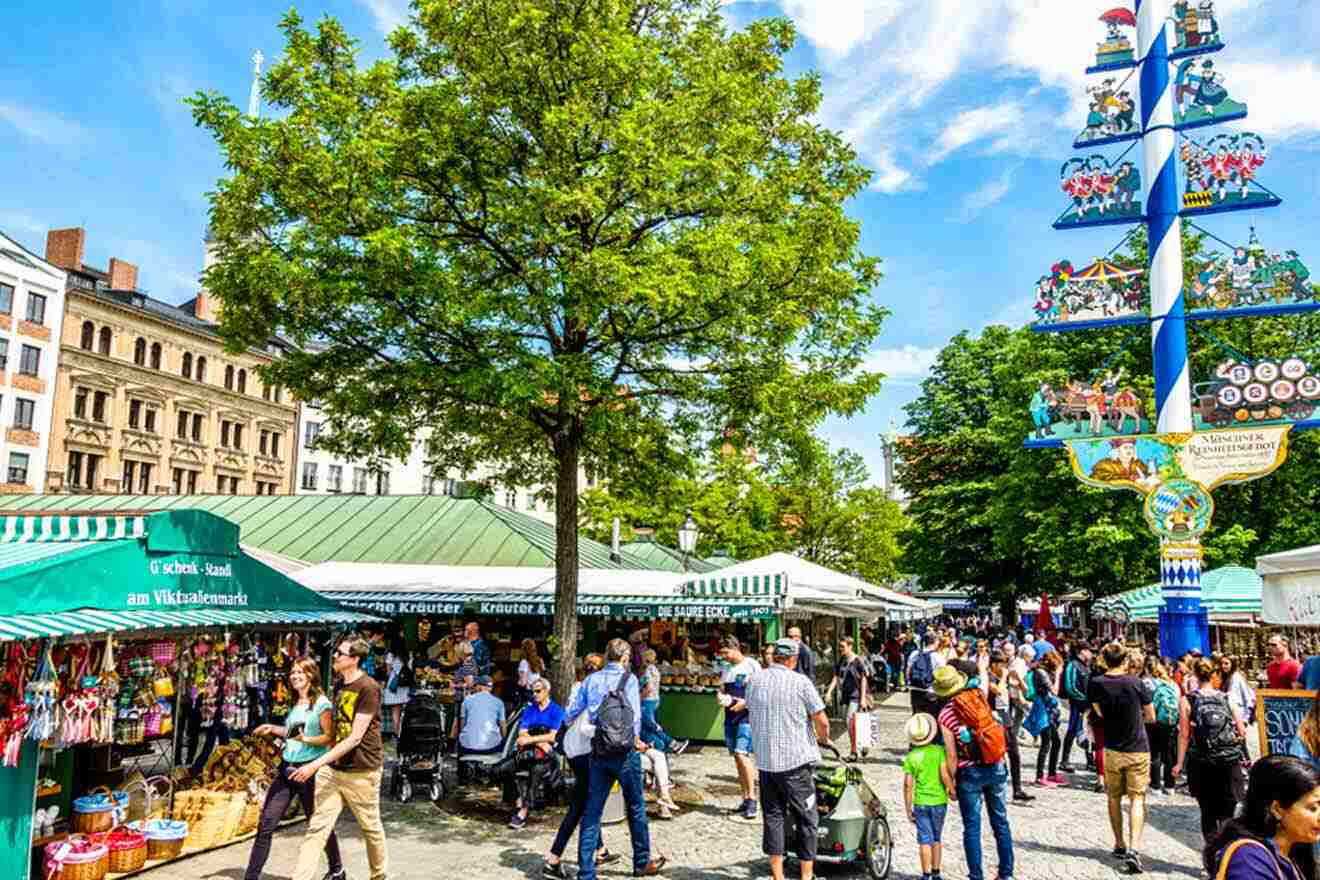 A market in a city with many people walking around.