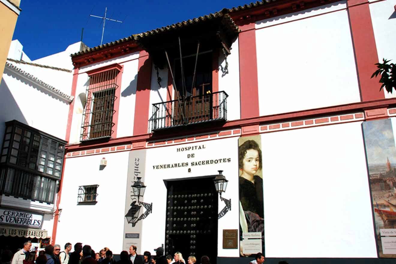 A building with many people walking in front of it.