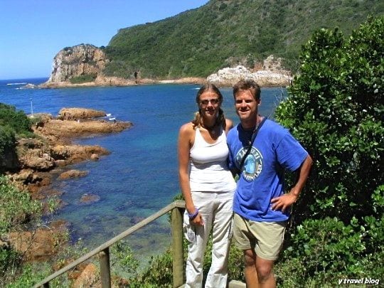 people standing on a beach lookout