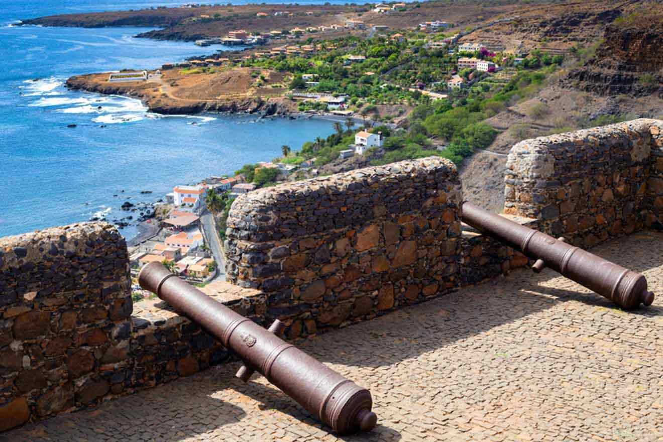 Cannons on a wall overlooking the ocean.