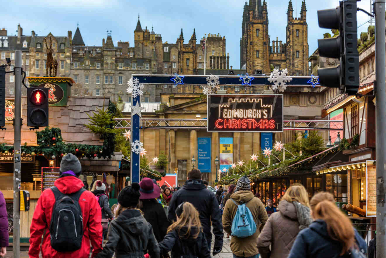 People passing through the entrance of a Christmas market