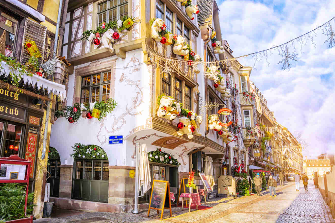 A house decorated with teddy bears and other Christmas decorations