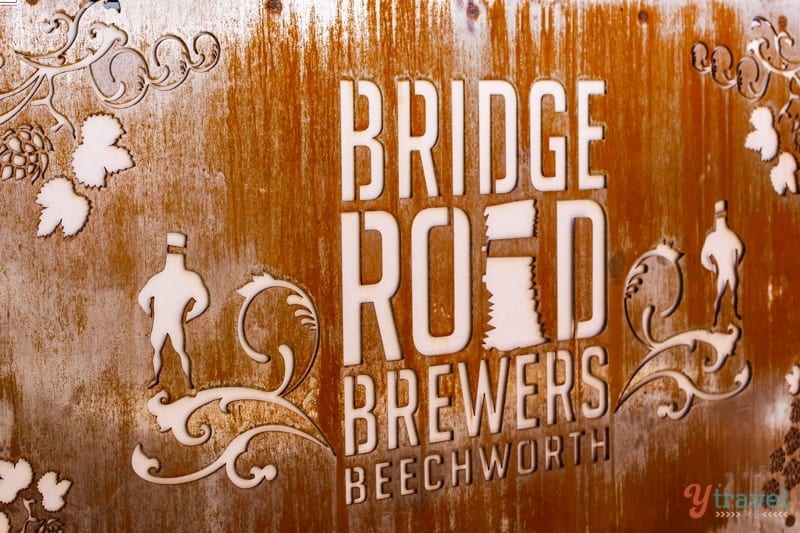 an iron sign saying bridge road brewers beechwoorth