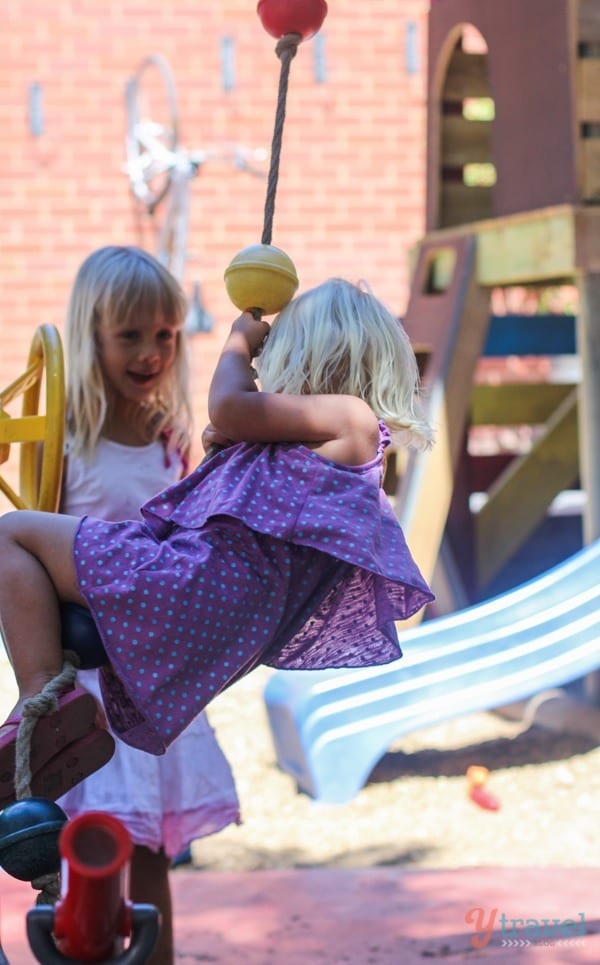 girls playing on a playground