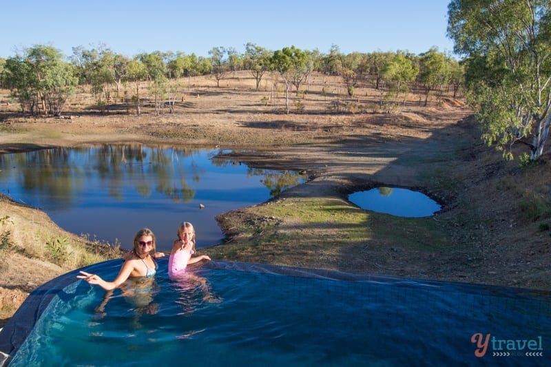 people swimming in hot springs