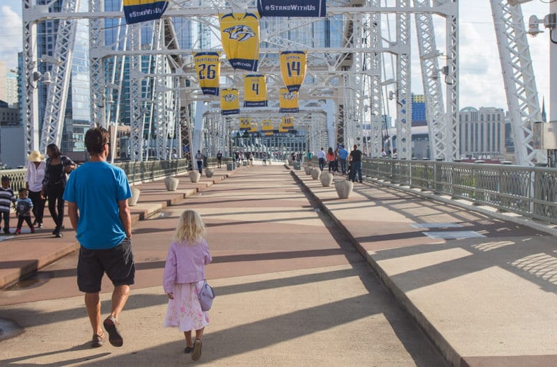 Walking across the pedestrian bridge in Nashville