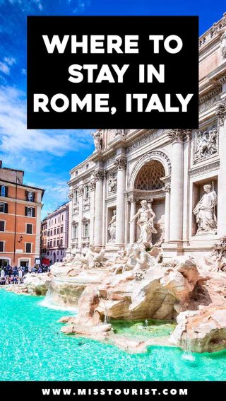 a stone fountain in front of Trevi Fountain with statues