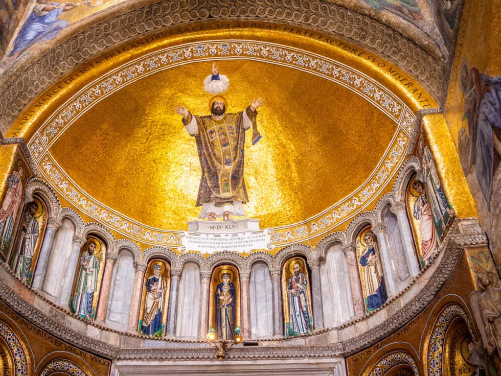 gold roof inside st mark's basilica with saints painted on 