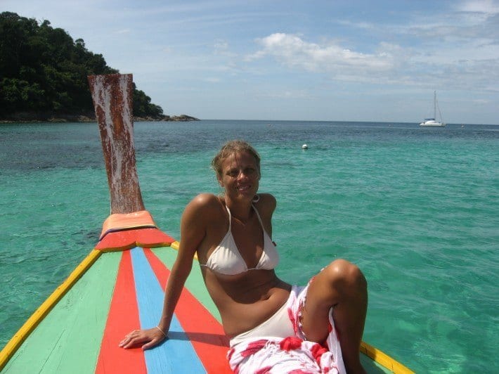 a woman sitting on a boat