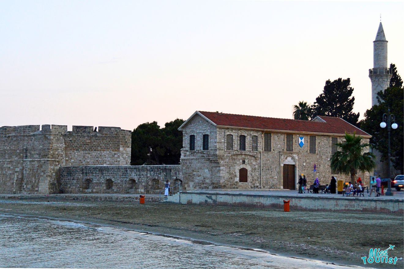 A fort next to the see with a tower next to it