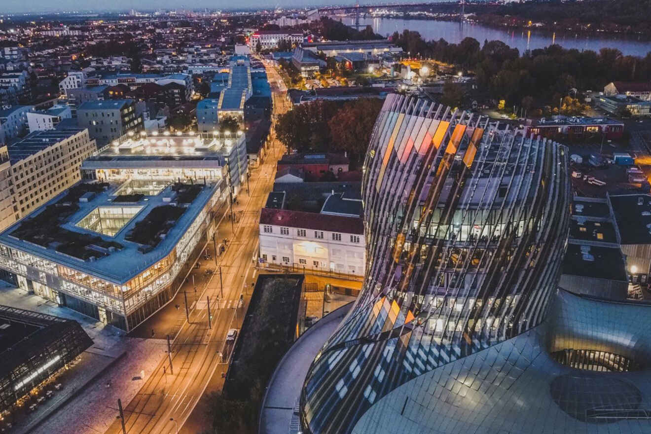 An aerial view of the city of Bordeaux at dusk.