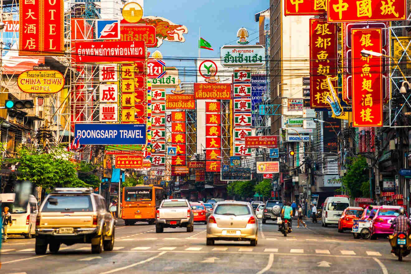 Vivid street scene in Bangkok's Chinatown with dense signage in Chinese characters, active traffic, and urban hustle.