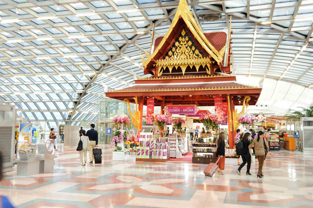 Traditional Thai pavilion inside Suvarnabhumi Airport in Bangkok, offering a cultural welcome amid modern architectural elements.