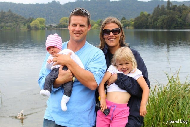 family posing with baby and child