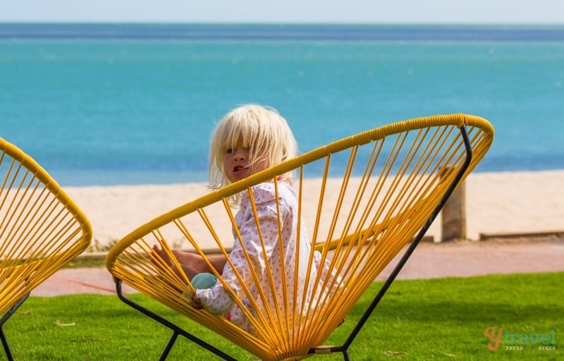 little girl sitting in a chair