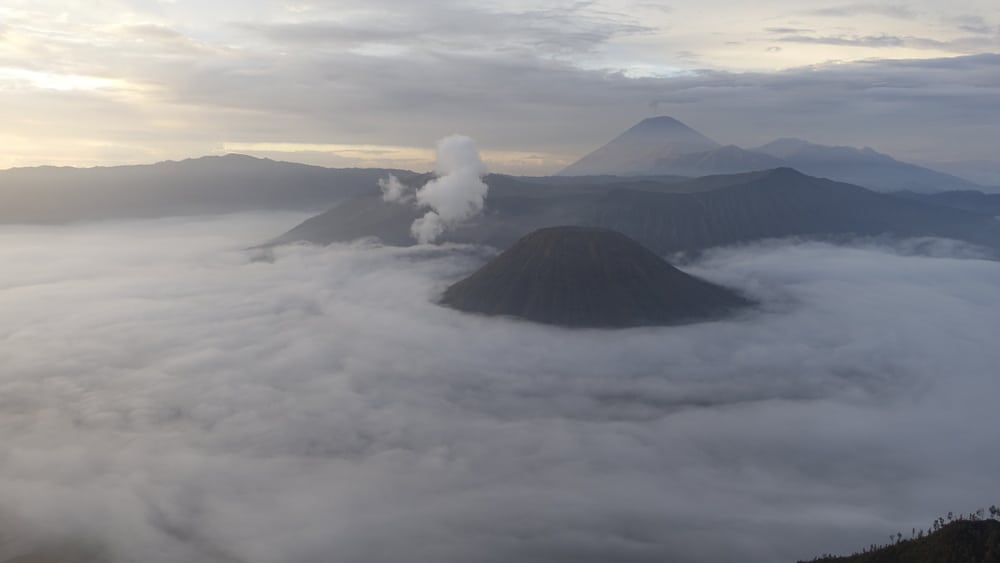 Mount Bromo at Sunrise shrouded in clouds 