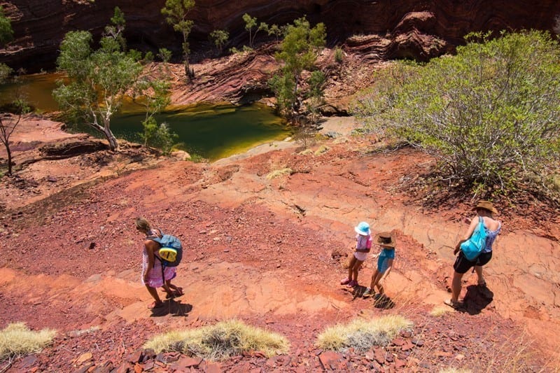 people hiking in Hammersley gorge Karijini