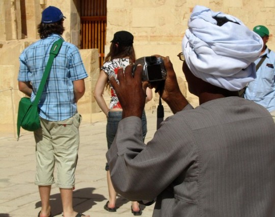 a man using a camera