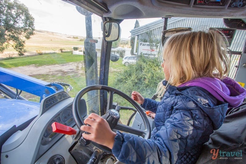 girl driving a tractor