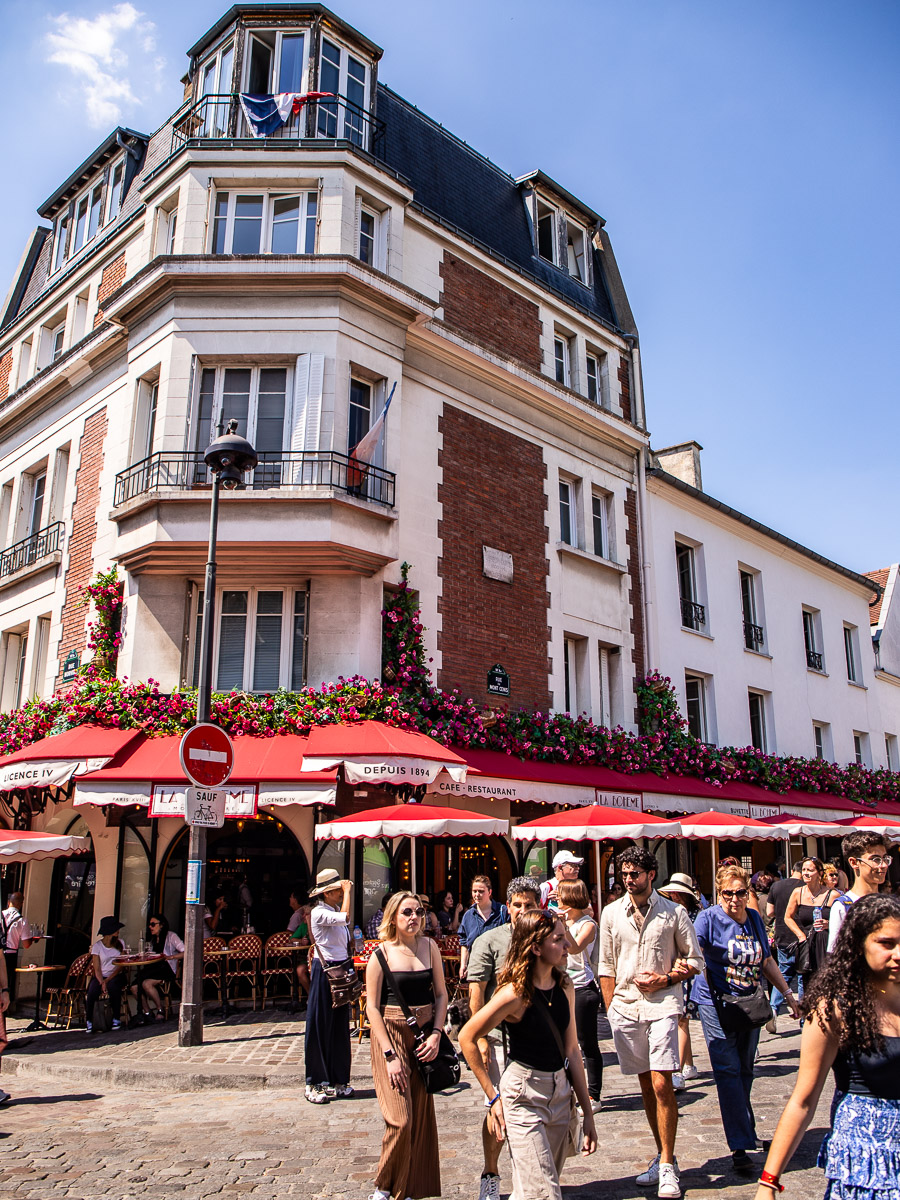 People standing outside a cafe in Paris