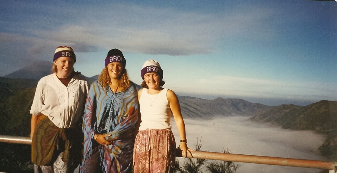 three girls posing in front of volcano on trail S