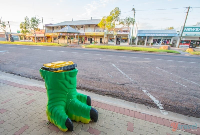 bin with dinosaur foot in main street of winton