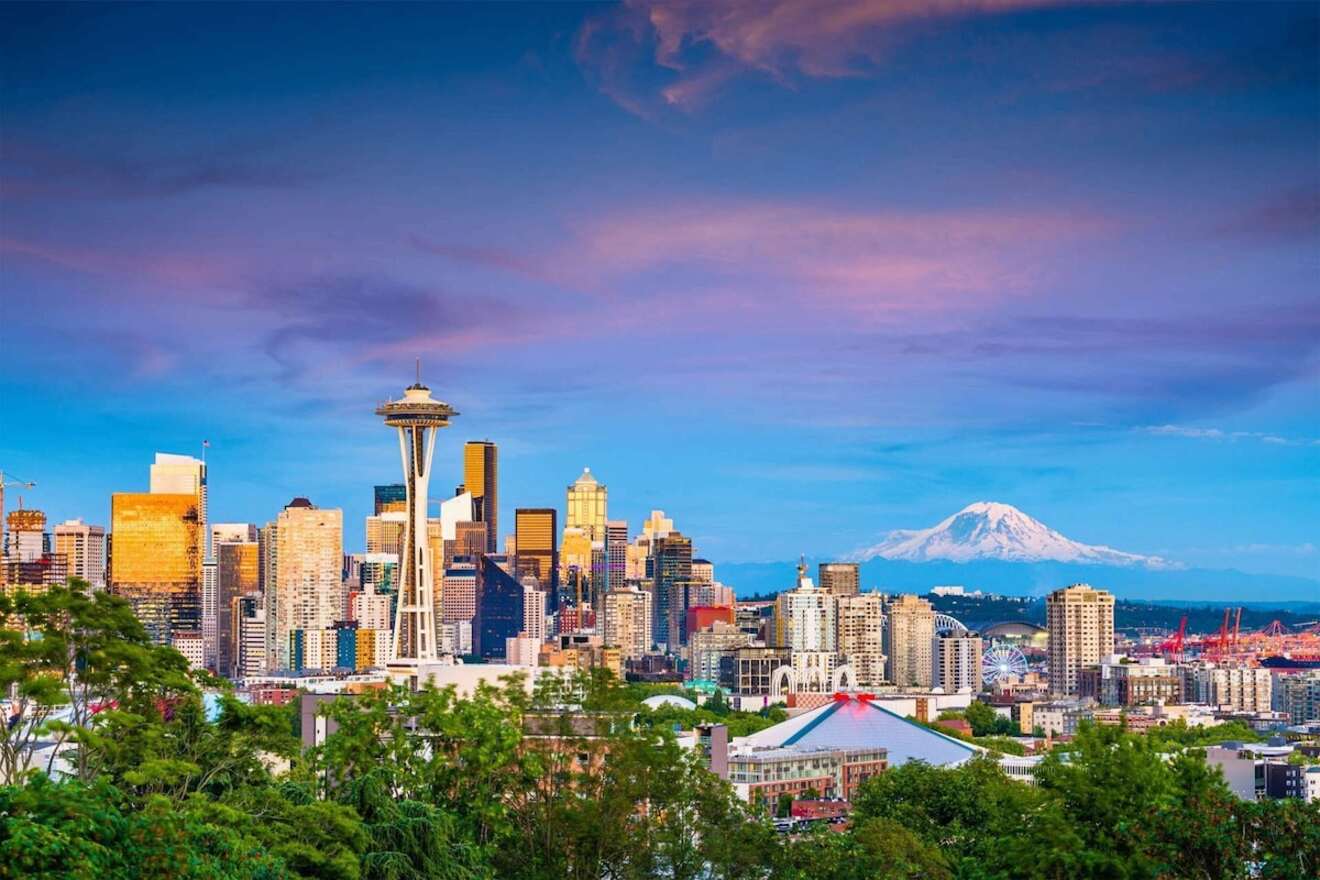 Seattle skyline at dusk with the Space Needle in the foreground and Mount Rainier providing a majestic backdrop