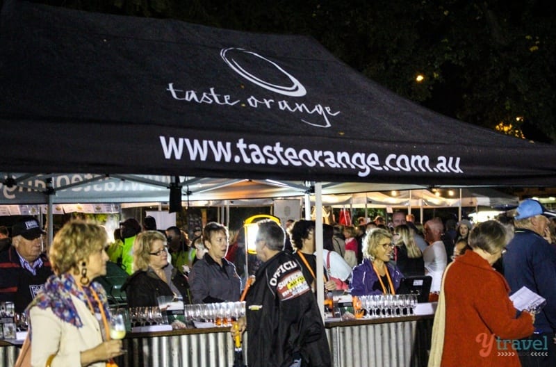 crowd of people standing in a tent