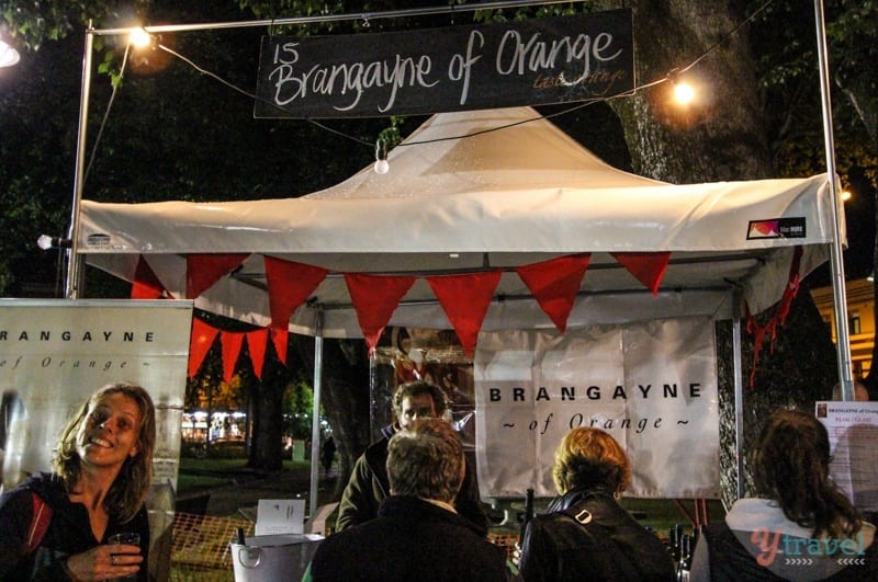 people ordering food at a tent stand