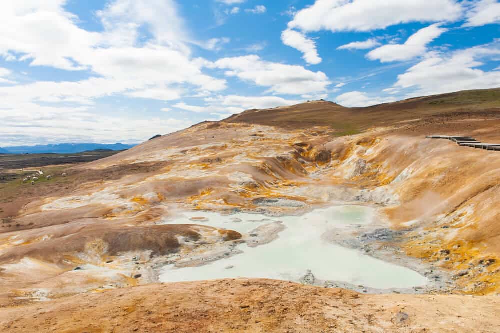 blue thermal pool in orange landscape of Leirhnjukur