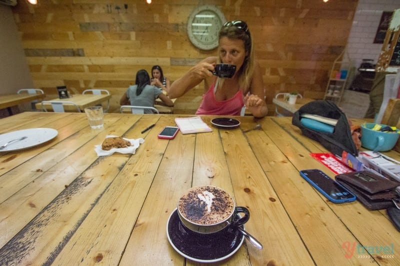 woman drinking coffee at Bambino Espresso, Mount Isa, Queensland, Australia