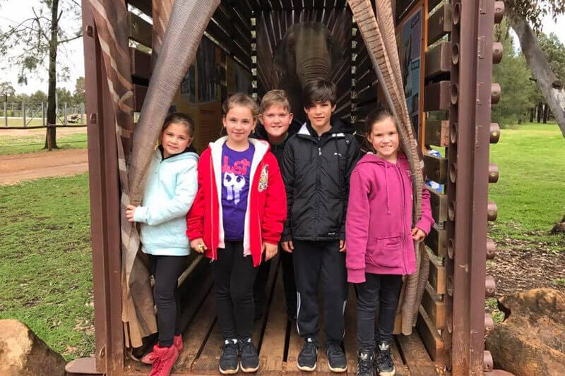 group of kids posing for photo