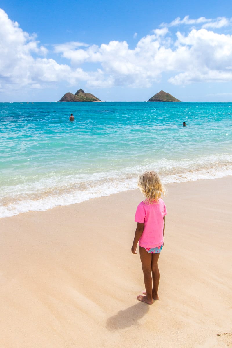 girl standing on Lanikai Beach, Oahu, Hawaii