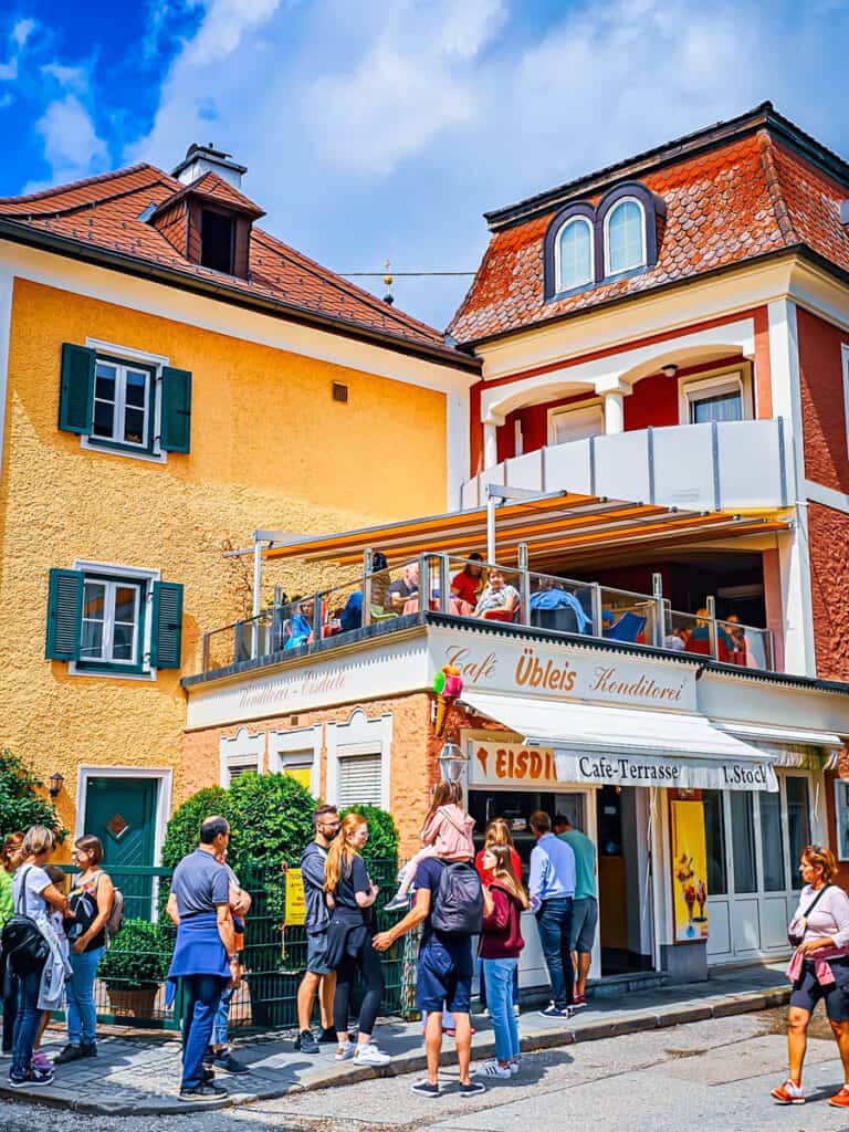 colorful buildings with people lined up outside