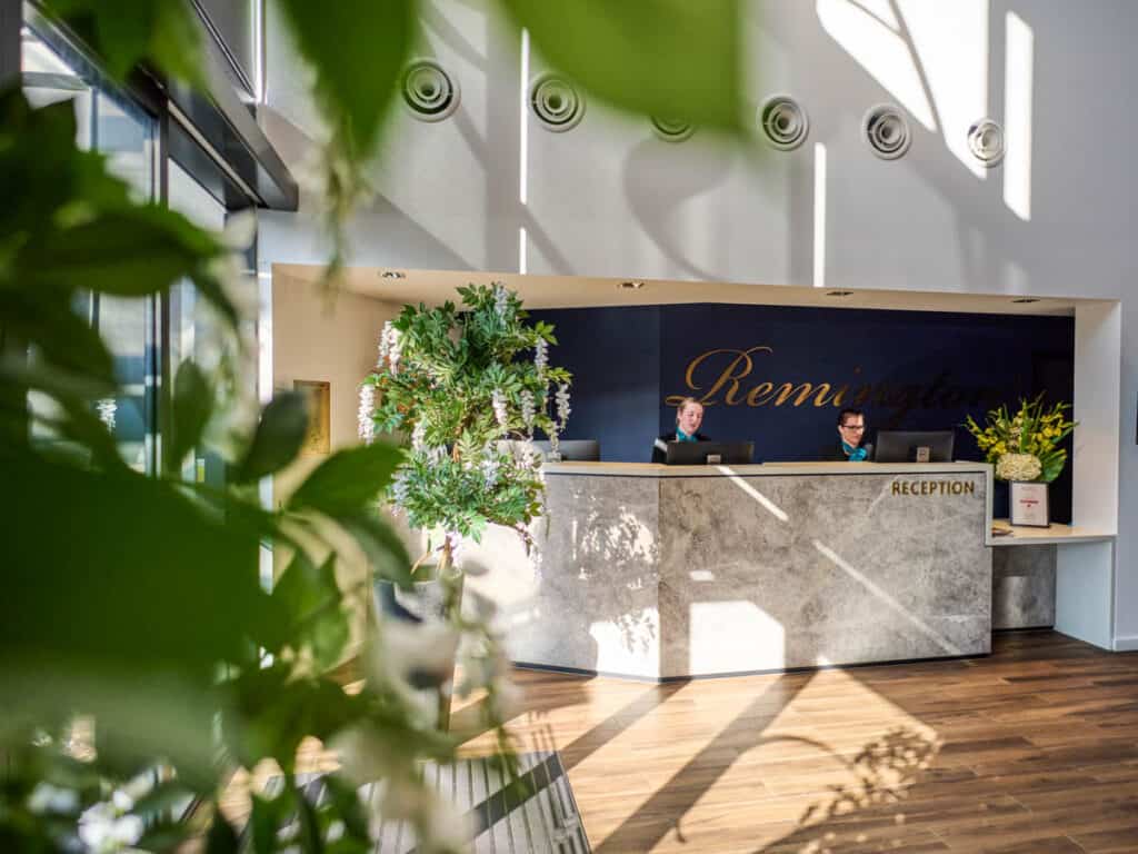 check in desk and foliage in foyer of remington hotel