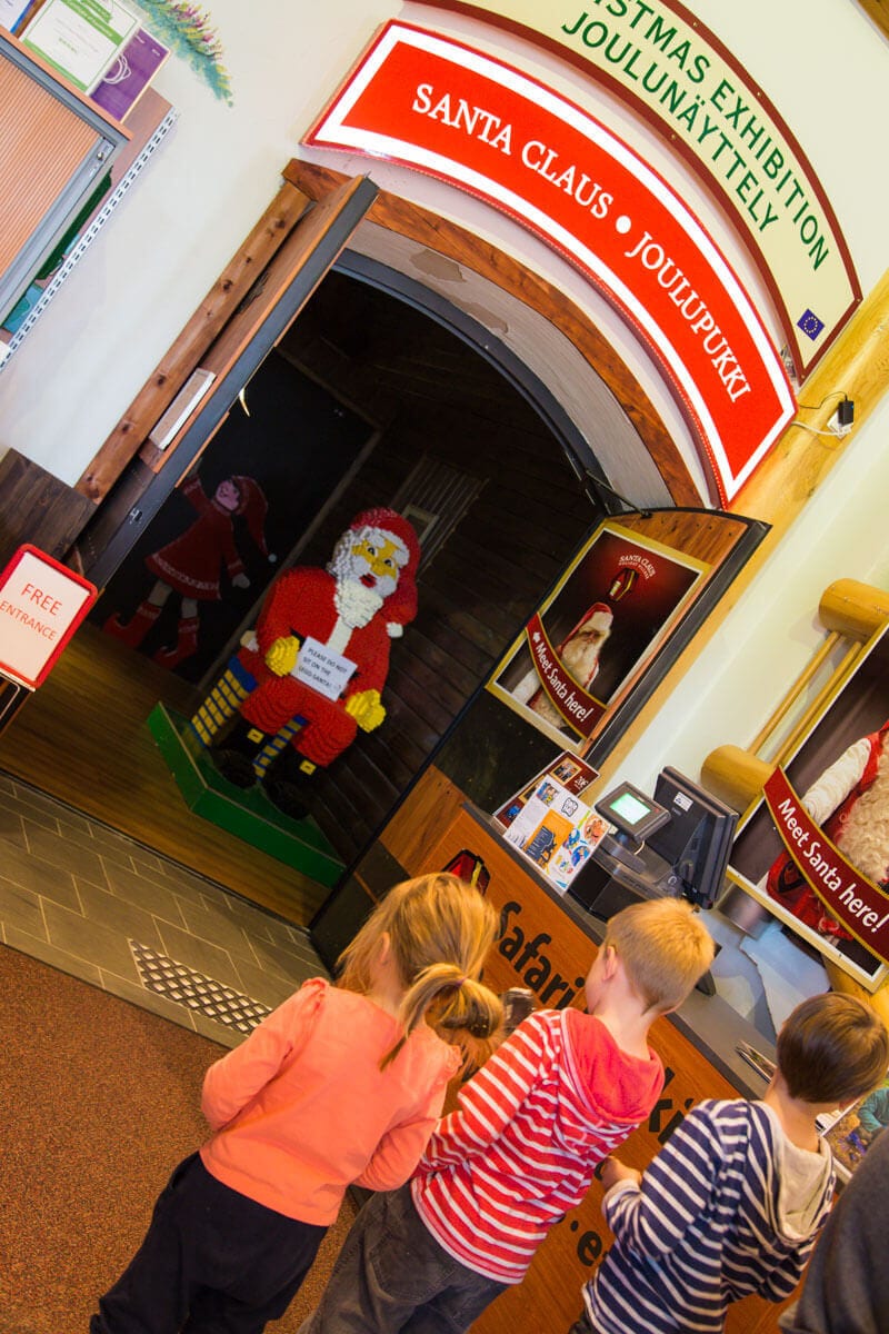 children looking at santa claus exhibit