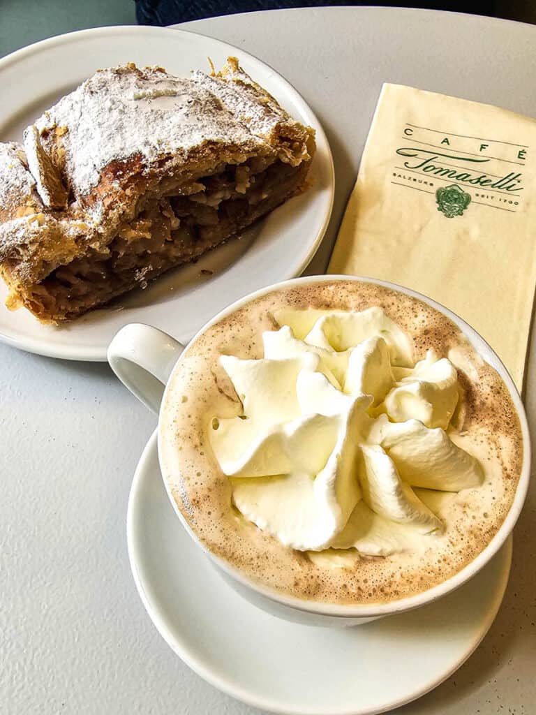 coffee with apple strudel on table