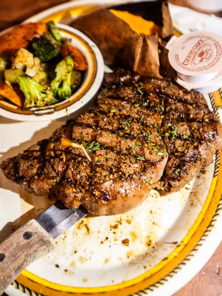 Ribeye steak on a plate.