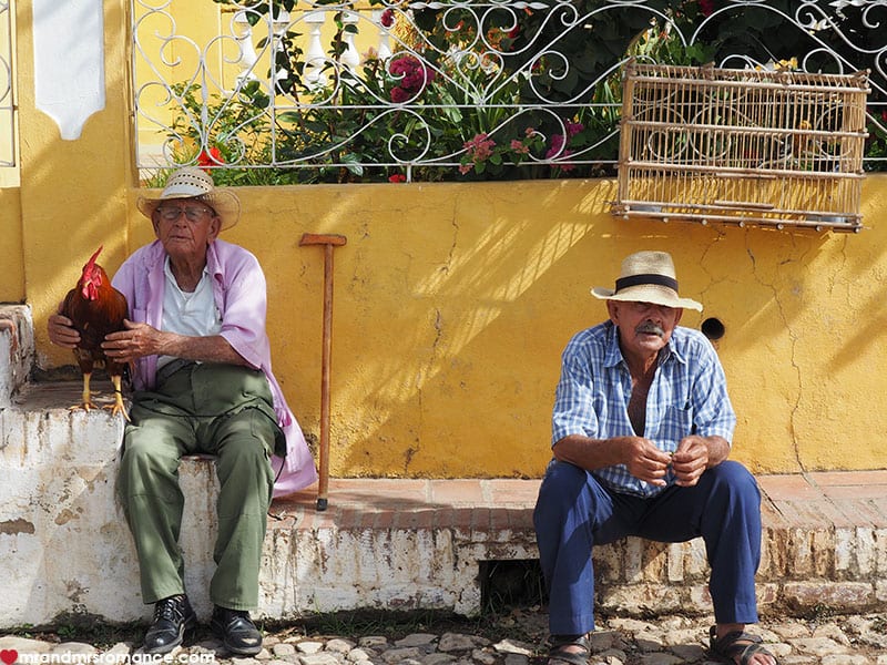 men sitting on a bench