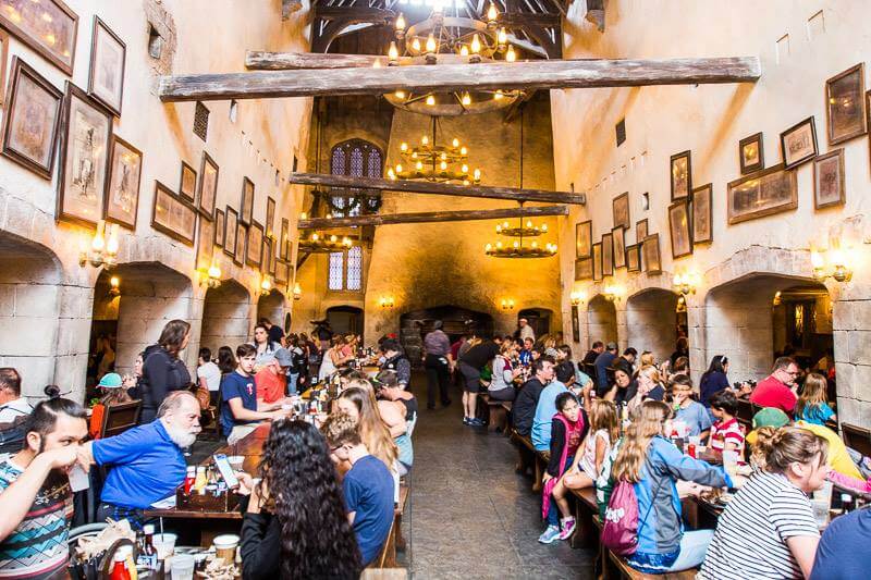 people eating at tables in the The Leaky Cauldron Universal Studios Orlando