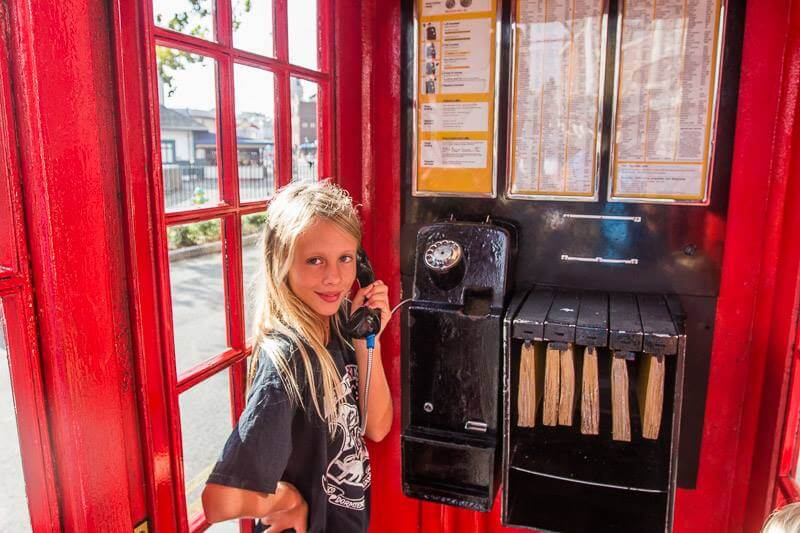 girl in red phone booth